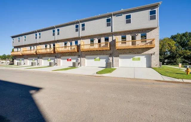 a front view of a building with a street