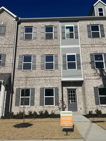 a front view of a house with yard