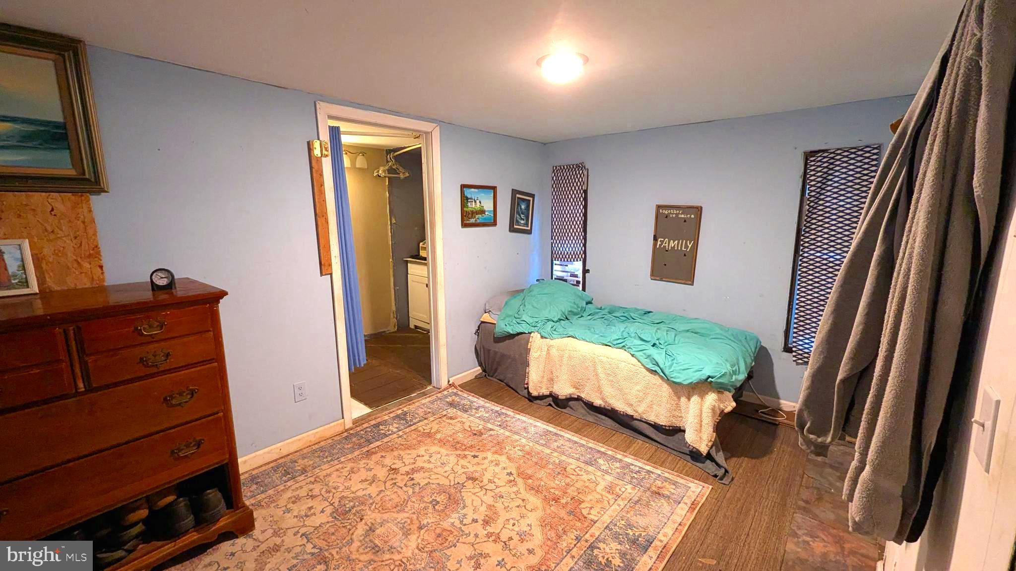 26835 Walker Road, Unit 56043 Seaford, DE 19973 - Photo 7 of 11 a living room with furniture and a dresser