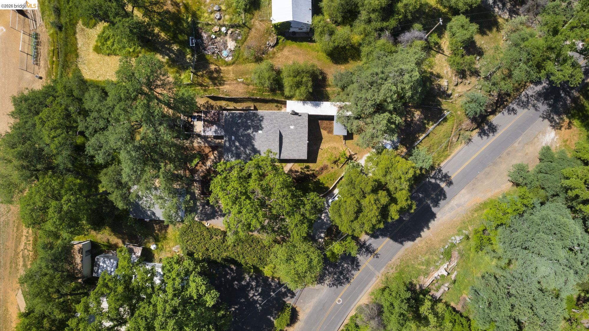 18363 Yosemite Road Tuolumne, CA 95379 - Photo 30 of 34 Aerial perspective showcasing a property surrounded by mature trees