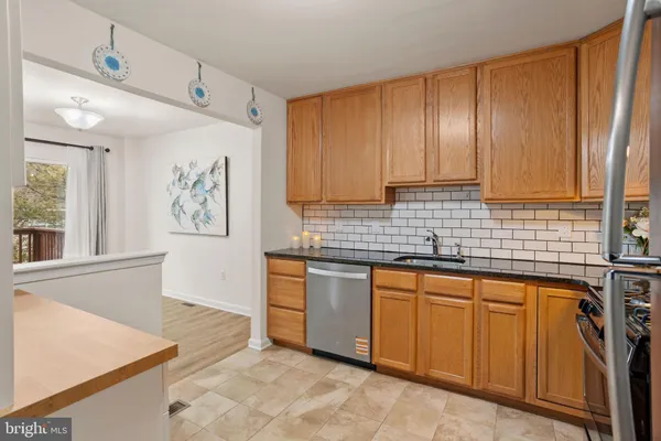 a kitchen with cabinets a sink and appliances