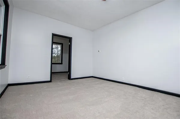 a view of a room with a hallway