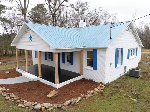 a house with trees in front of it