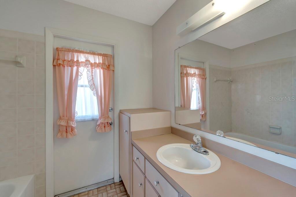 5861 Adams Road Venice, FL 34293 - Photo 31 of 51 Bathroom 2 has exterior door and Tub/Shower