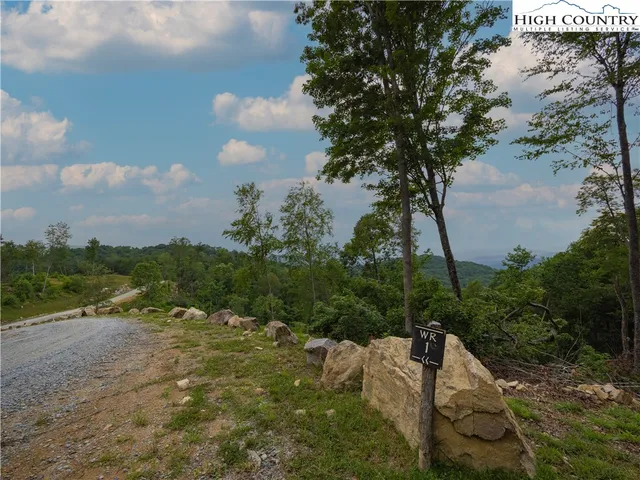a view of a lake with a yard