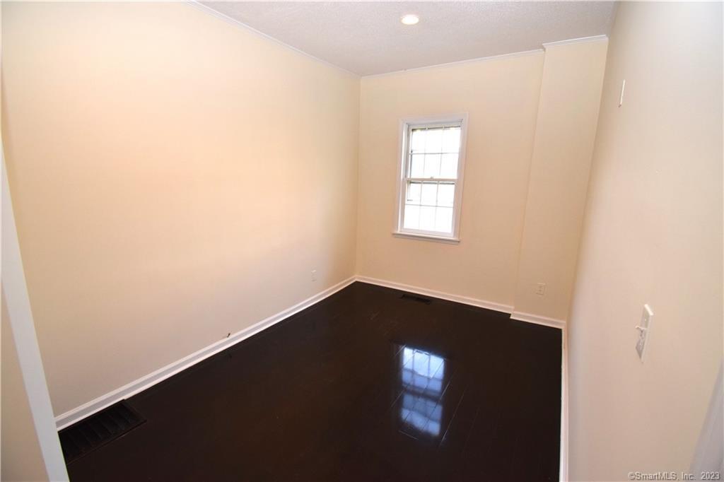 159 Main Street, Unit E Chester, CT 06412 - Photo 13 of 17 an empty room with a window