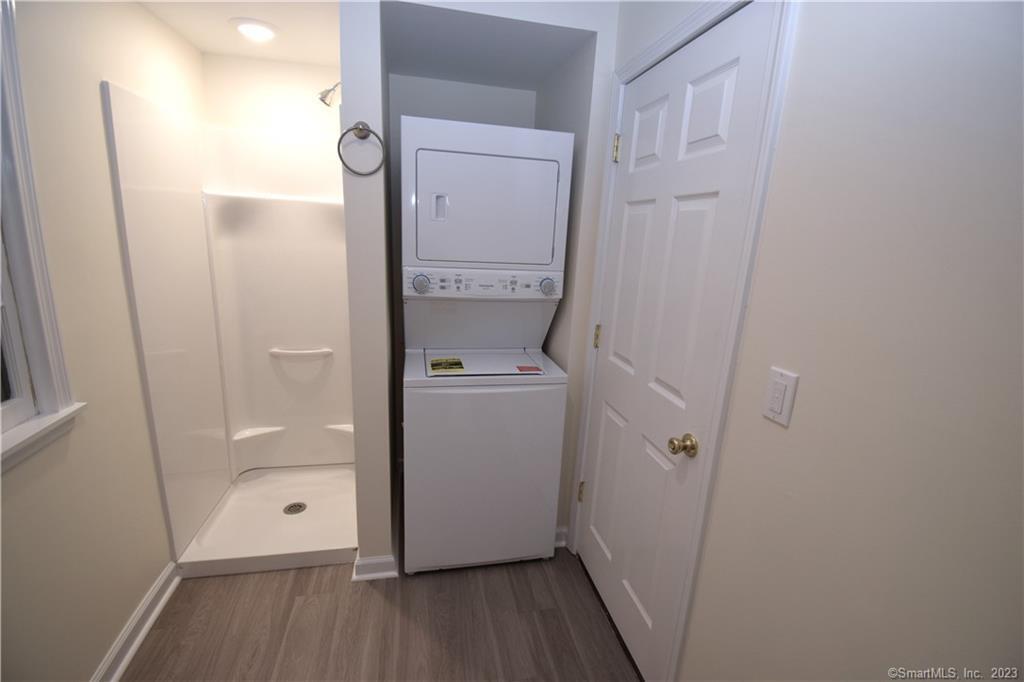159 Main Street, Unit E Chester, CT 06412 - Photo 16 of 17 a bathroom with a granite countertop shower