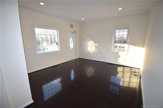 a view of empty room with windows