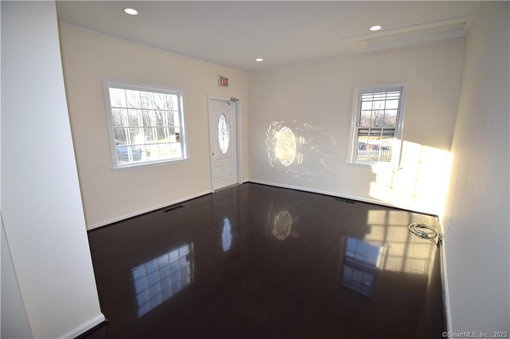 159 Main Street, Unit E Chester, CT 06412 - Photo 5 of 17 a view of empty room with windows