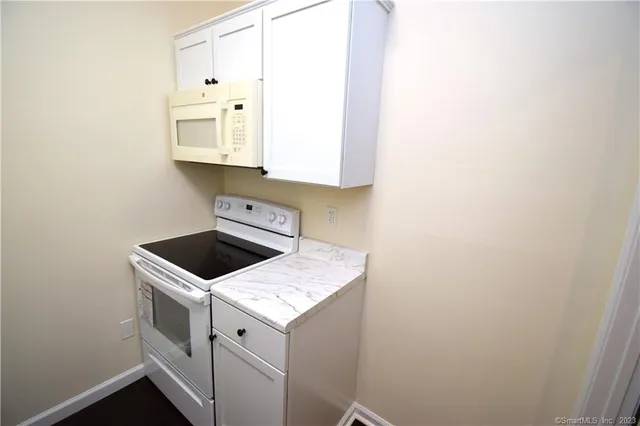 a utility room with sink dryer and washer