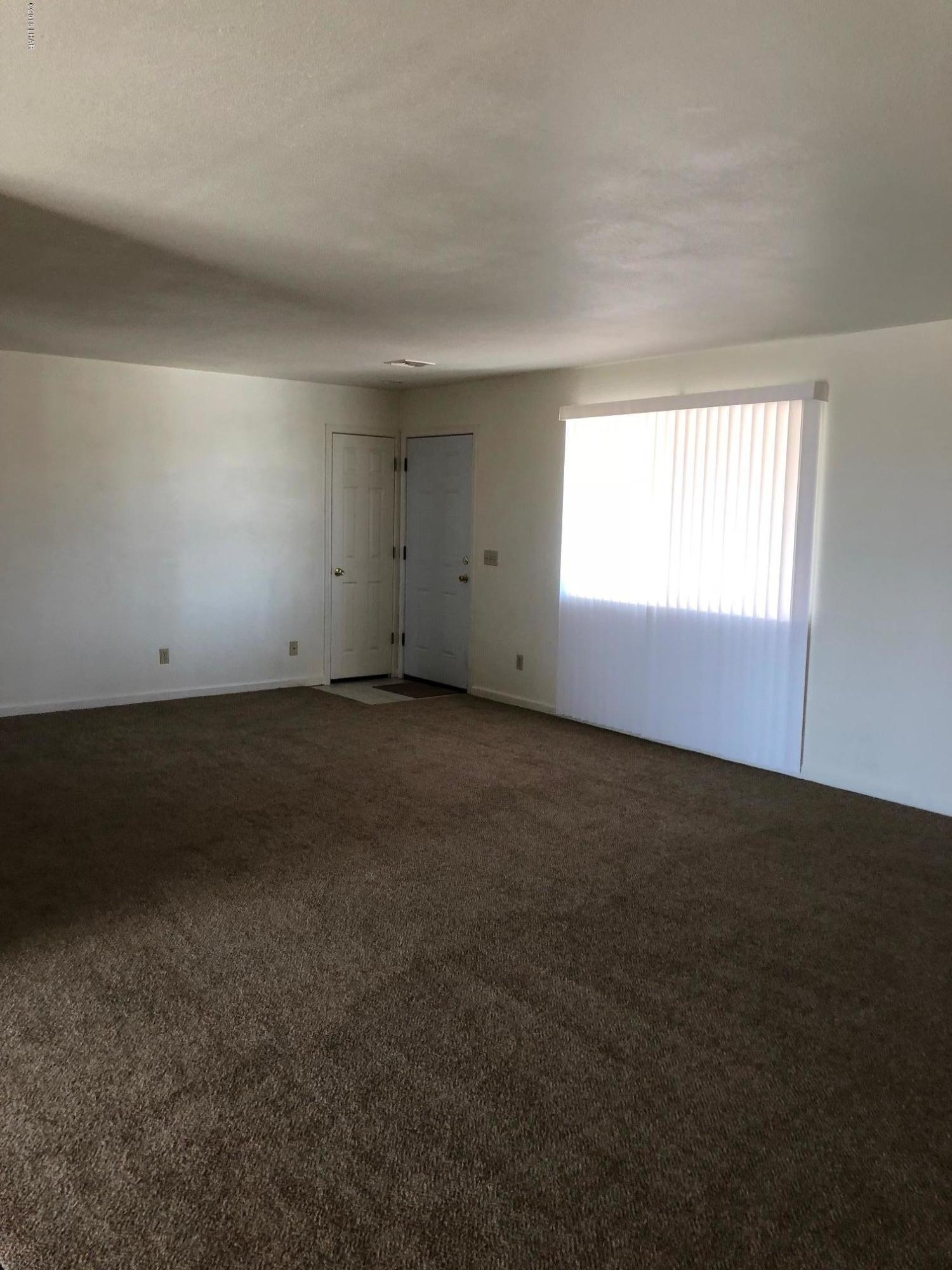 3739 Hope Road Golden Valley, AZ 86413 - Photo 11 of 26 an empty room with a window