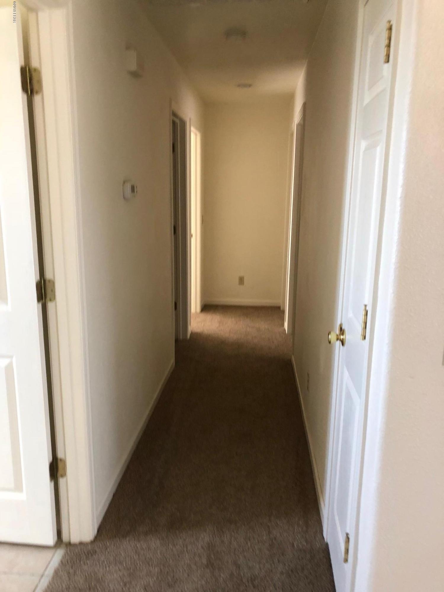 3739 Hope Road Golden Valley, AZ 86413 - Photo 13 of 26 a view of a hallway with a door