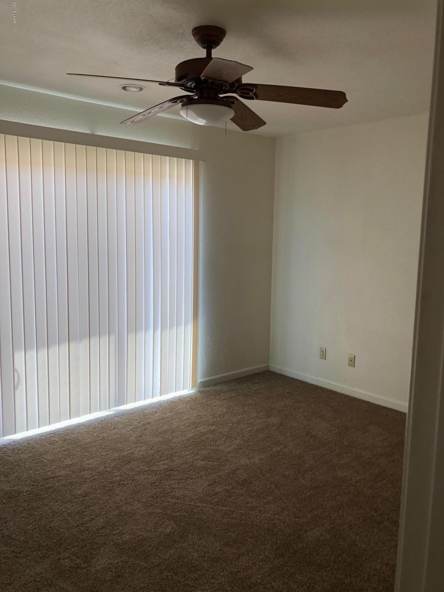 3739 Hope Road Golden Valley, AZ 86413 - Photo 17 of 26 a view of an empty room and a window