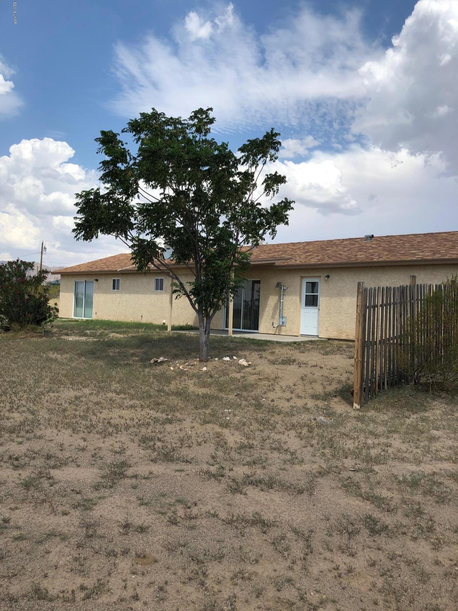 3739 Hope Road Golden Valley, AZ 86413 - Photo 25 of 26 a view of a house with a yard