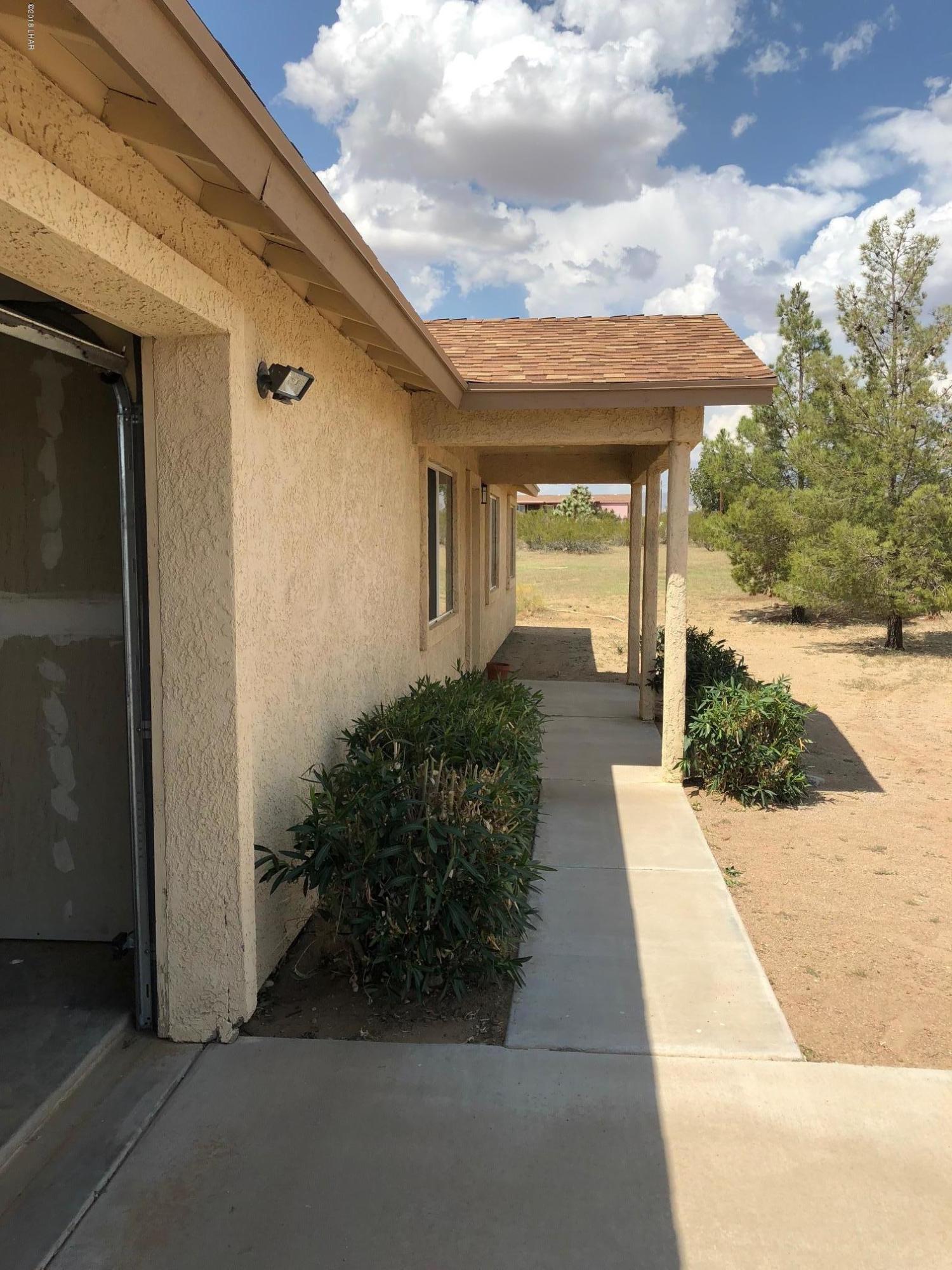 3739 Hope Road Golden Valley, AZ 86413 - Photo 4 of 26 a view of a house with backyard and garden