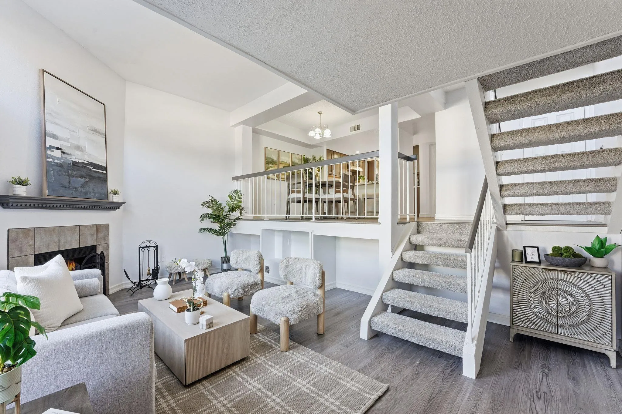 8753 Spring Canyon Drive Spring Valley, CA 91977 - Photo 1 of 43 a living room with furniture a fireplace and wooden floor