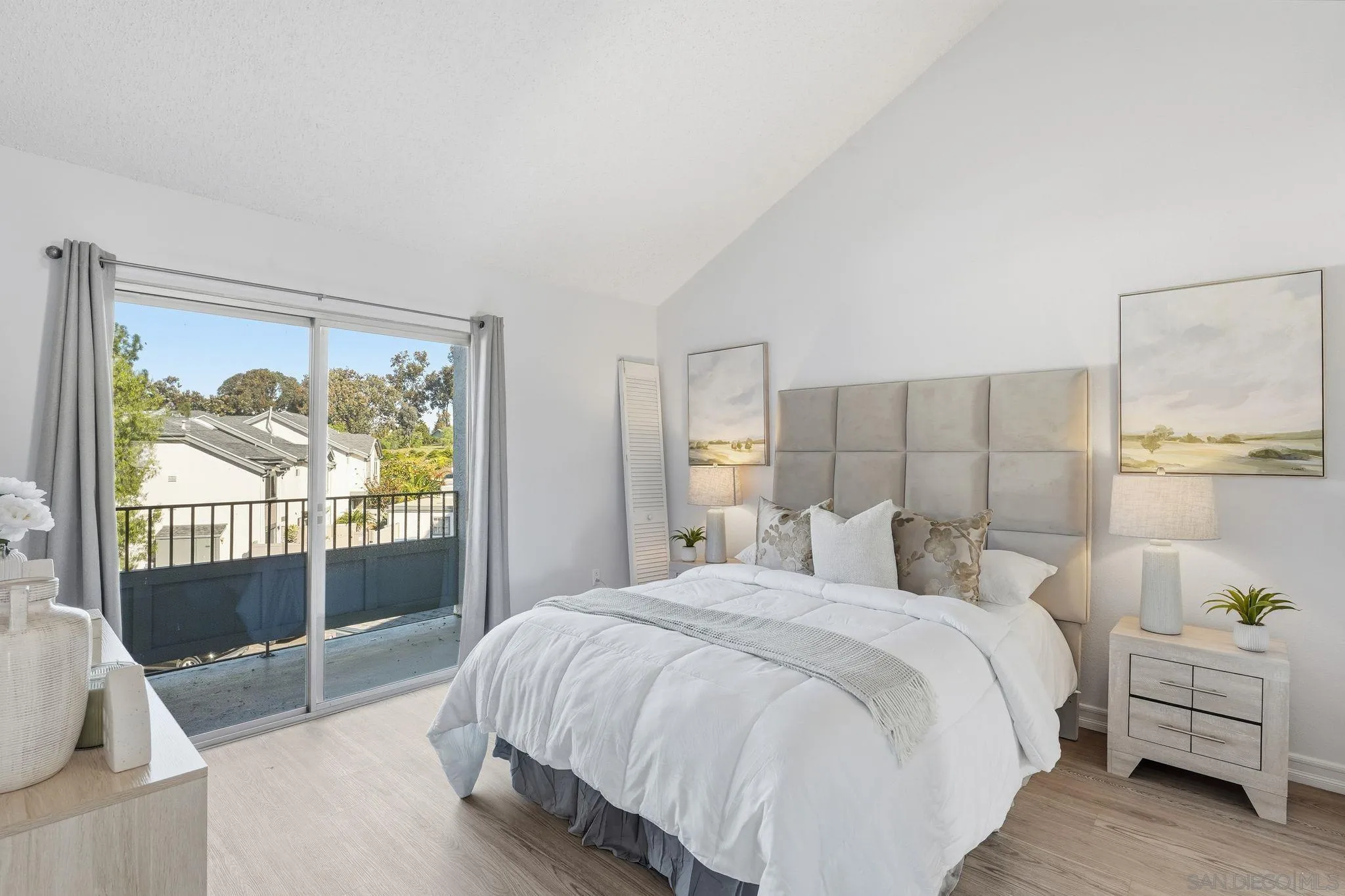 8753 Spring Canyon Drive Spring Valley, CA 91977 - Photo 18 of 43 a bedroom with a bed and glass door