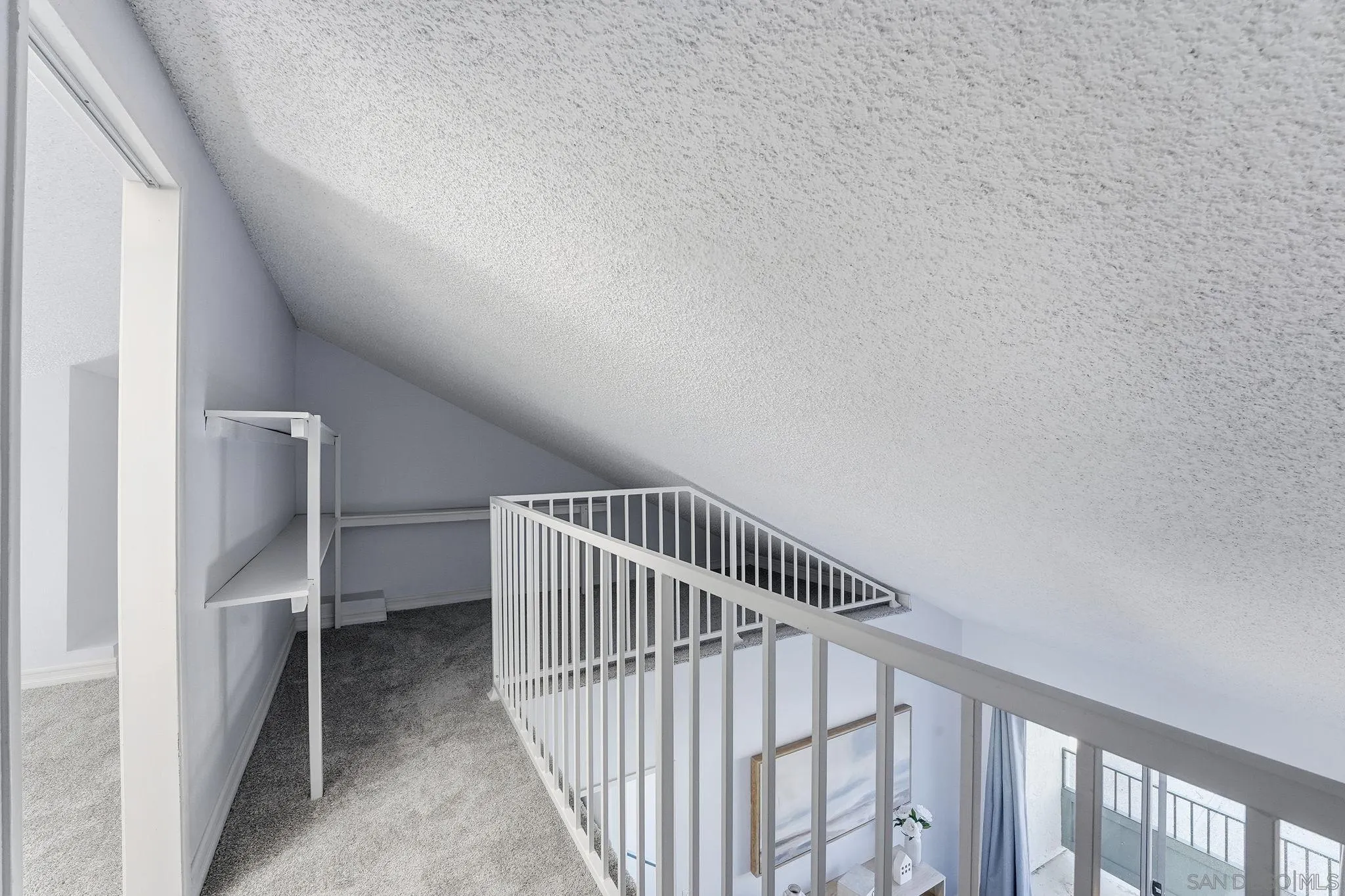 8753 Spring Canyon Drive Spring Valley, CA 91977 - Photo 22 of 43 a view of staircase with railing and white walls