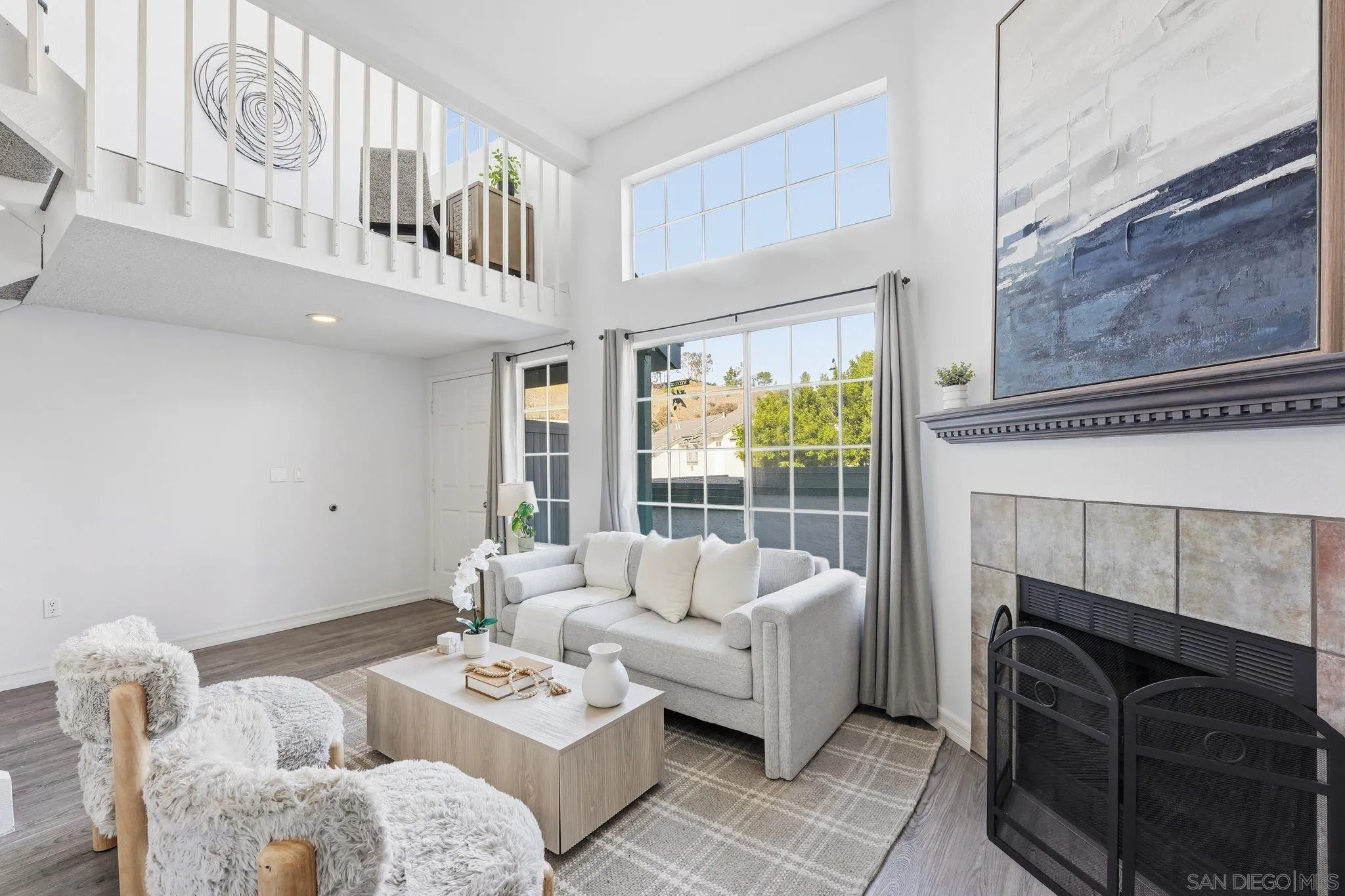 8753 Spring Canyon Drive Spring Valley, CA 91977 - Photo 6 of 43 a living room with furniture and a fireplace