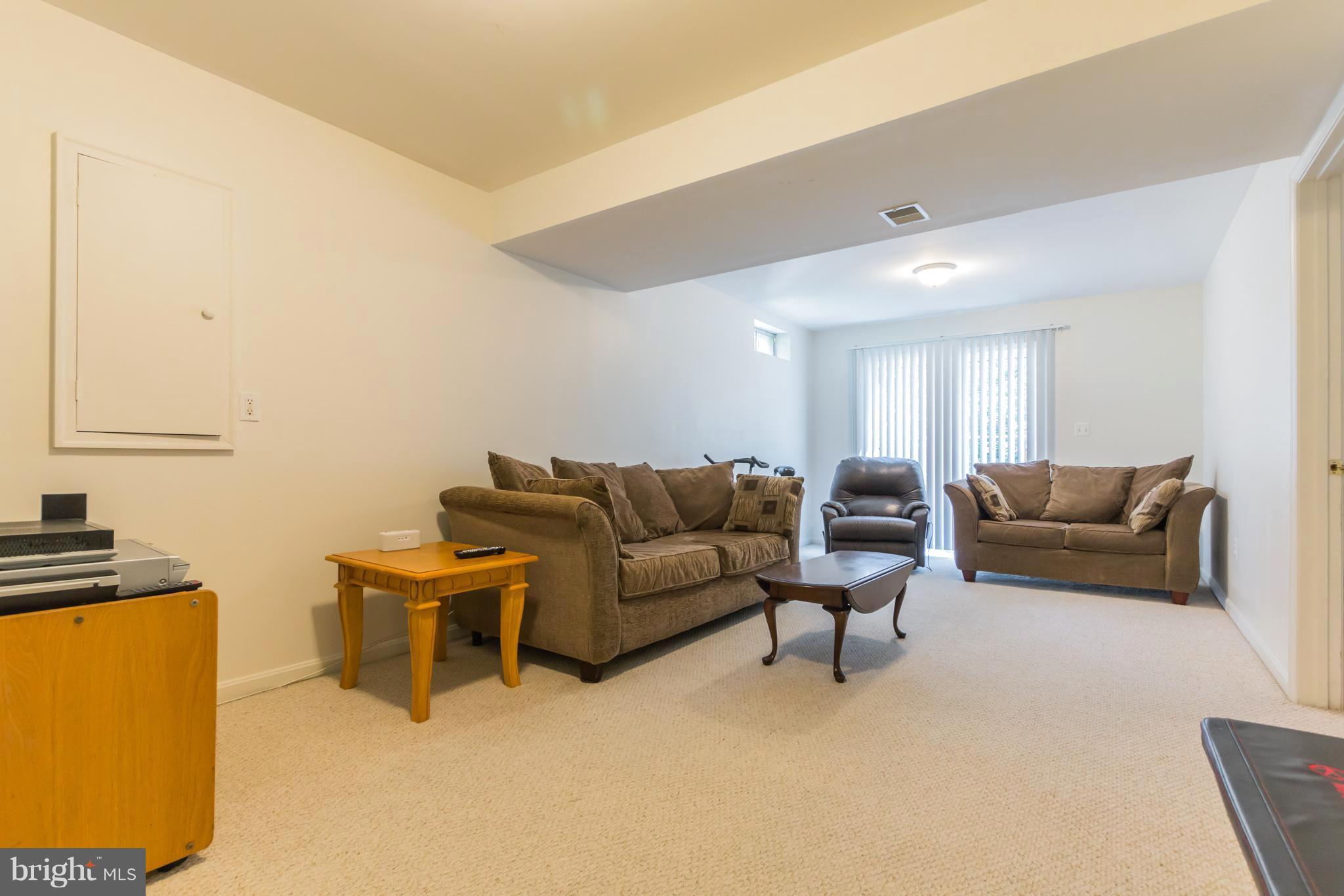 8100 Pepper Ridge Way Gaithersburg, MD 20877 - Photo 23 of 30 Large Recreation Room - Level Walk-Out to Backyard