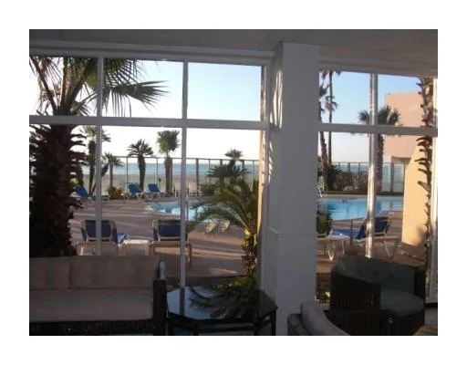 a view of swimming pool with outdoor seating