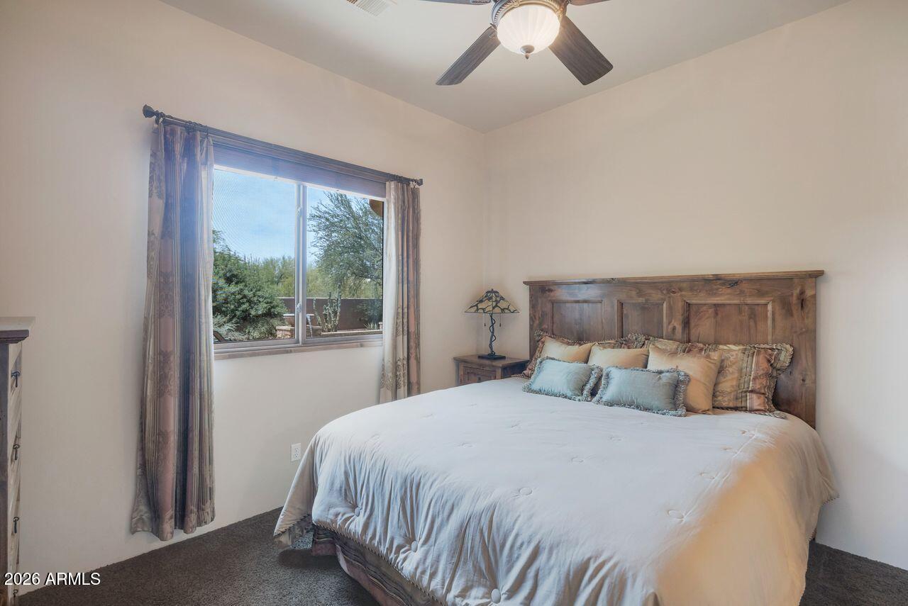 18507 East Picacho Road Rio Verde, AZ 85263 - Photo 25 of 33 a bedroom with a large bed and a large window