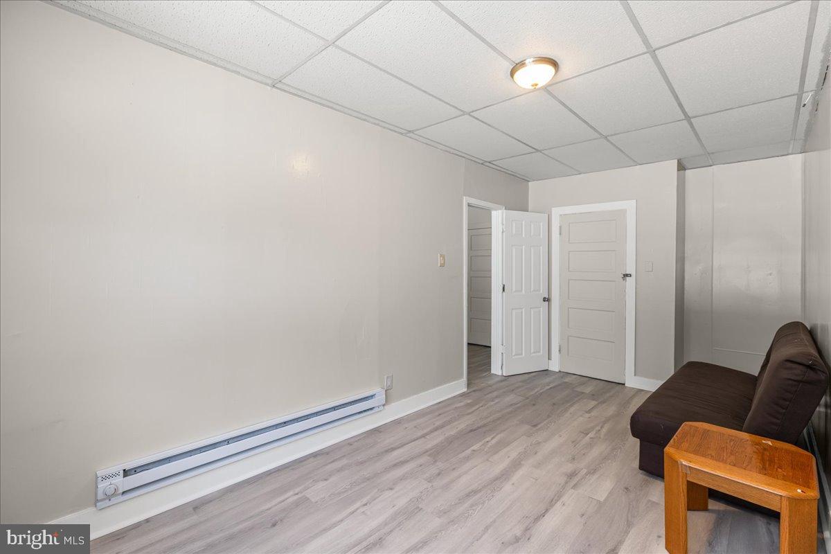 245 Warren Street Beverly, NJ 08010 - Photo 18 of 20 a view of livingroom with furniture and wooden floor