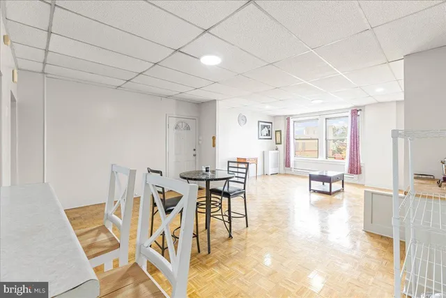a view of a livingroom with furniture and a table