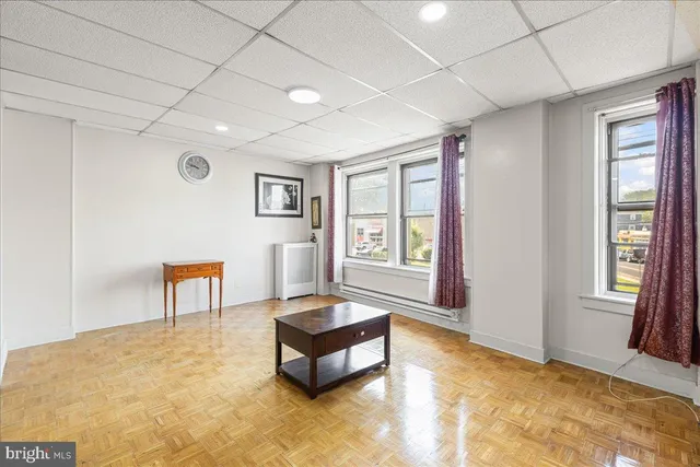 a spacious bedroom with a bed and a window