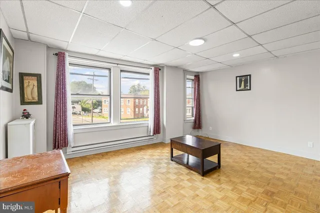 a living room with a couch and a window