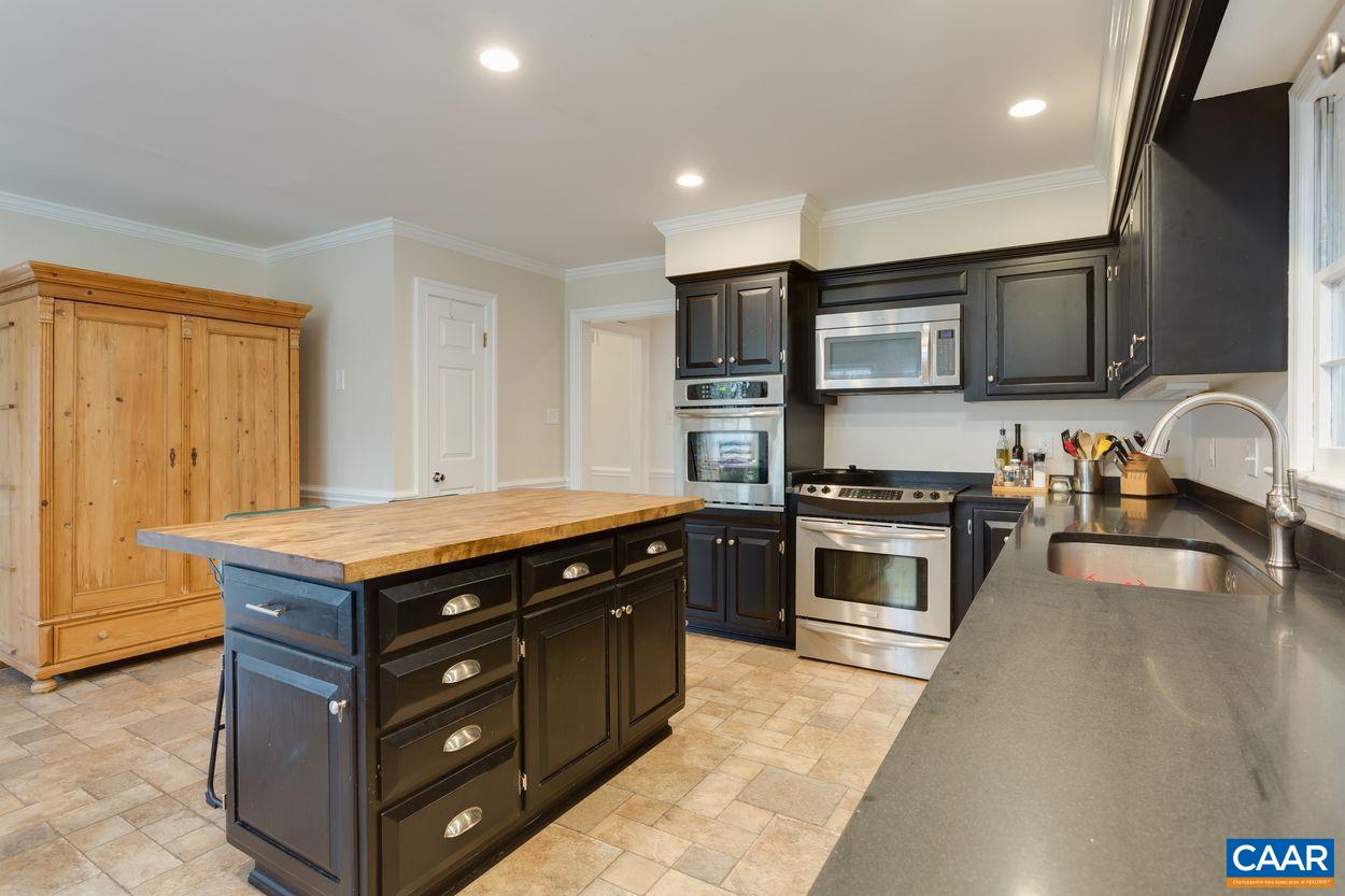 2485 Thrush Road Charlottesville, VA 22901 - Photo 11 of 23 a kitchen with stainless steel appliances granite countertop a stove a sink and a refrigerator