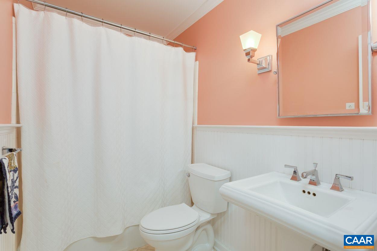 2485 Thrush Road Charlottesville, VA 22901 - Photo 14 of 23 a bathroom with a sink a toilet and shower curtain