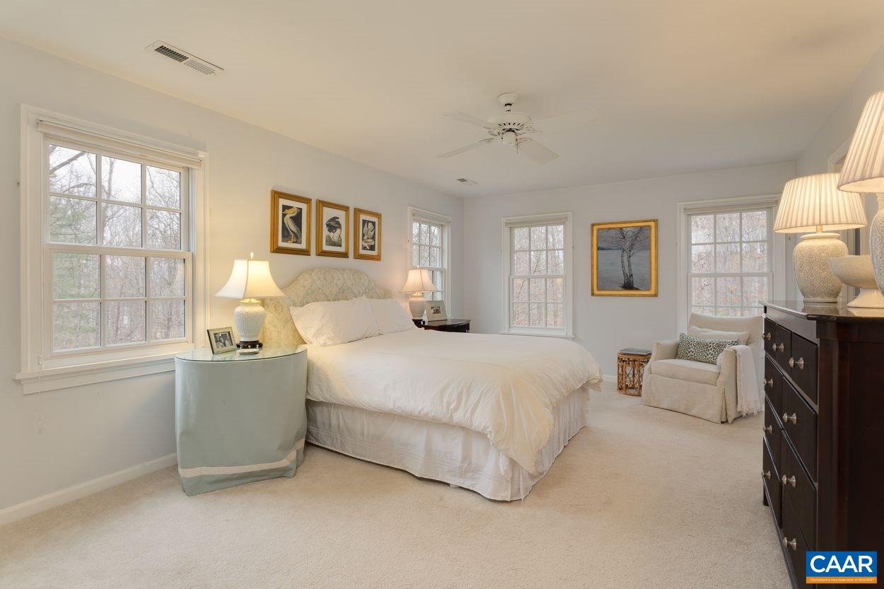 2485 Thrush Road Charlottesville, VA 22901 - Photo 17 of 23 a spacious bedroom with a bed and wooden floor