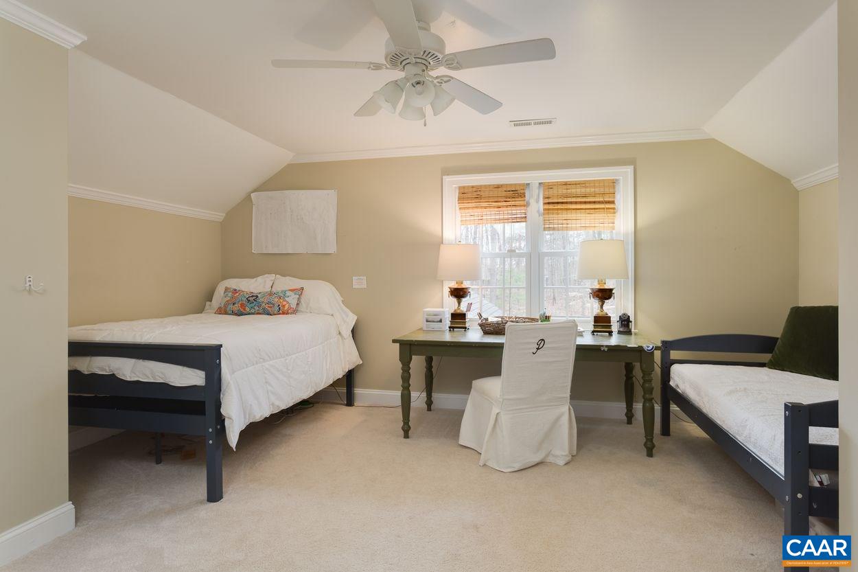 2485 Thrush Road Charlottesville, VA 22901 - Photo 22 of 23 a bedroom with a bed and a table