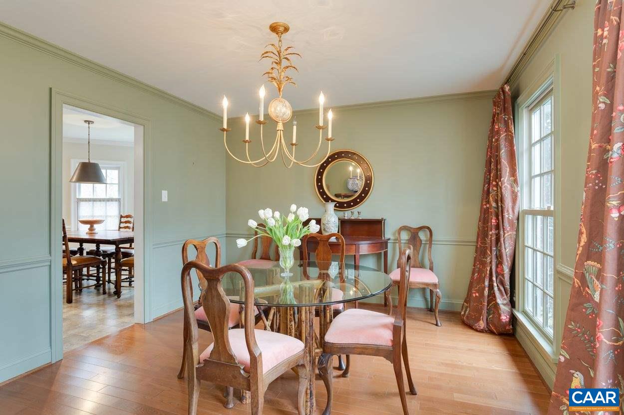 2485 Thrush Road Charlottesville, VA 22901 - Photo 7 of 23 a view of a dining room with furniture a chandelier and wooden floor