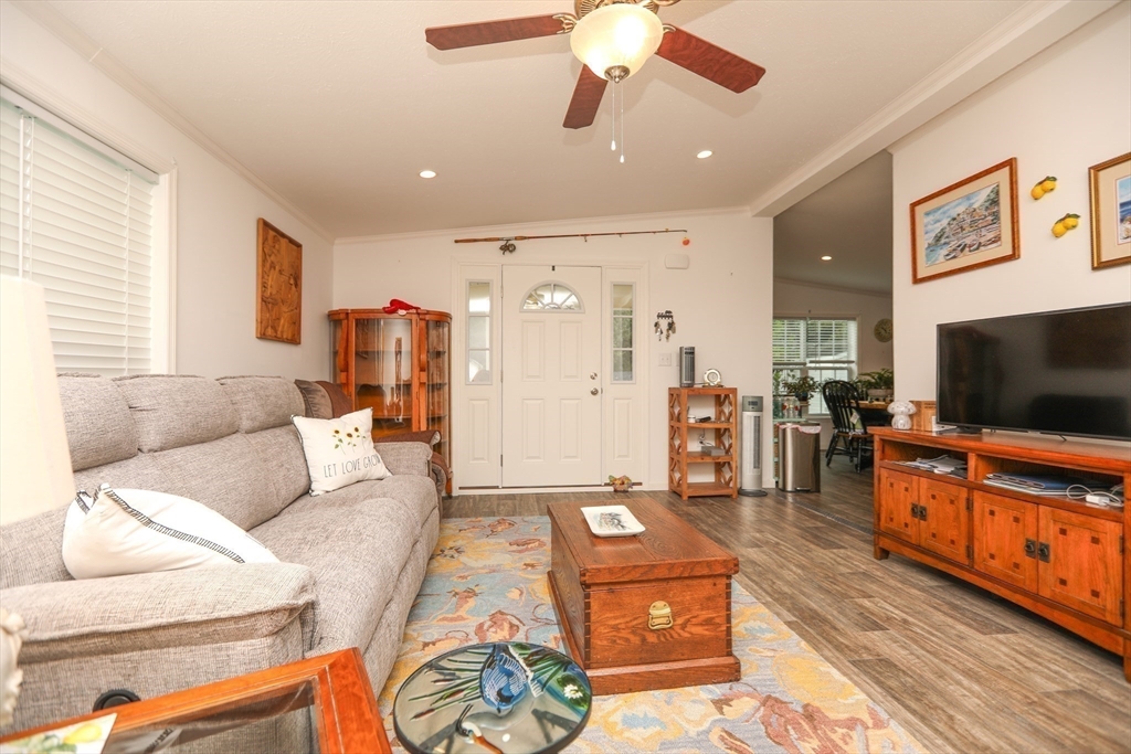 3 B Street Merrimac, MA 01860 - Photo 21 of 41 a living room with furniture and a flat screen tv