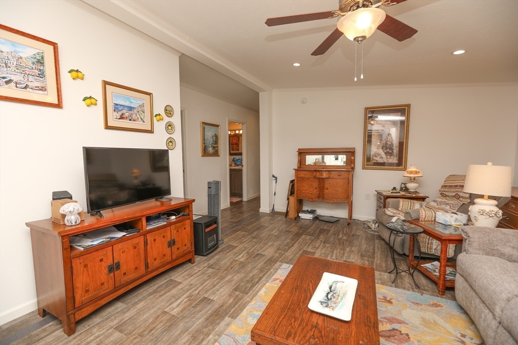3 B Street Merrimac, MA 01860 - Photo 22 of 41 a living room with furniture and a flat screen tv