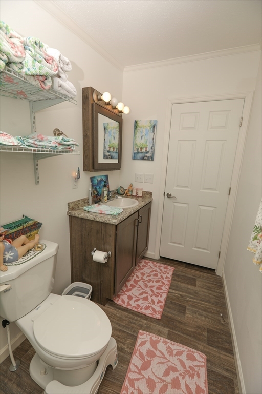 3 B Street Merrimac, MA 01860 - Photo 27 of 41 a bathroom with a toilet a sink and mirror