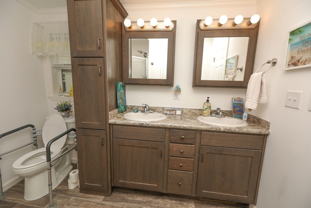 3 B Street Merrimac, MA 01860 - Photo 32 of 41 a bathroom with a granite countertop toilet sink and mirror