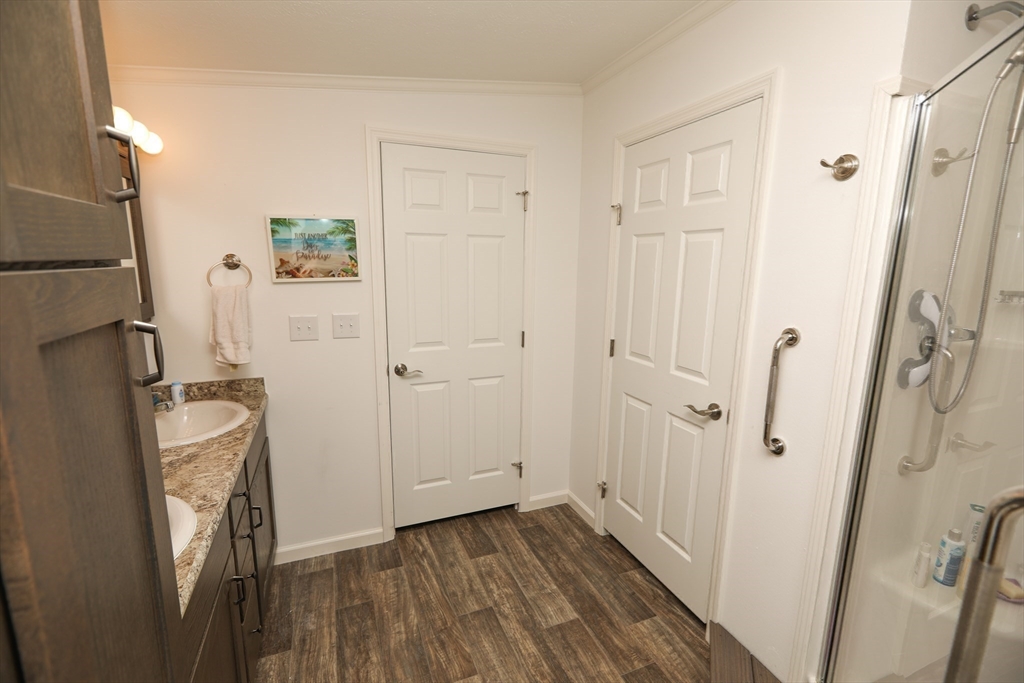 3 B Street Merrimac, MA 01860 - Photo 34 of 41 a view of a bathroom with wooden floor and mirror