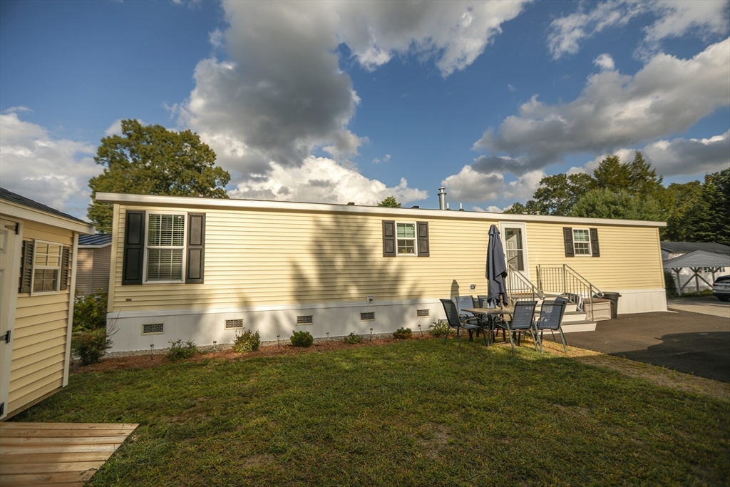 3 B Street Merrimac, MA 01860 - Photo 7 of 41 a backyard of a house with table and chairs