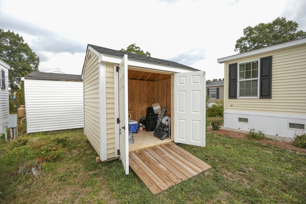 3 B Street Merrimac, MA 01860 - Photo 10 of 41 a view of a backyard with a large space and a porch