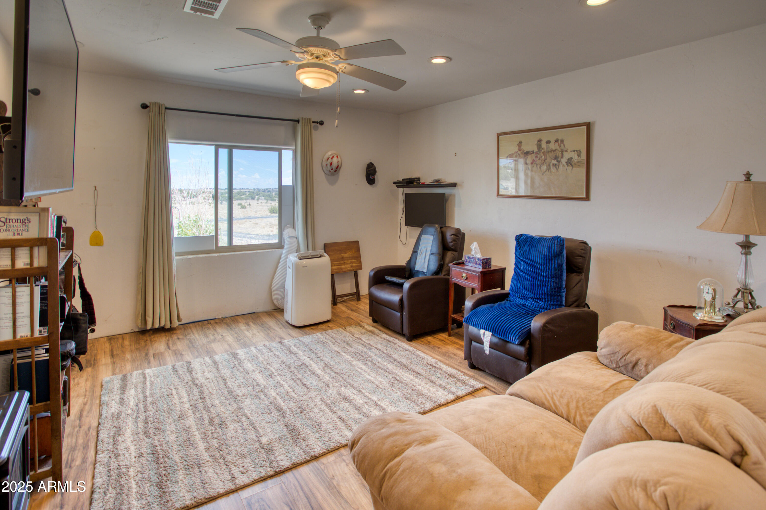 70 N5207 Concho, AZ 85924 - Photo 12 of 28 a living room with furniture and a flat screen tv