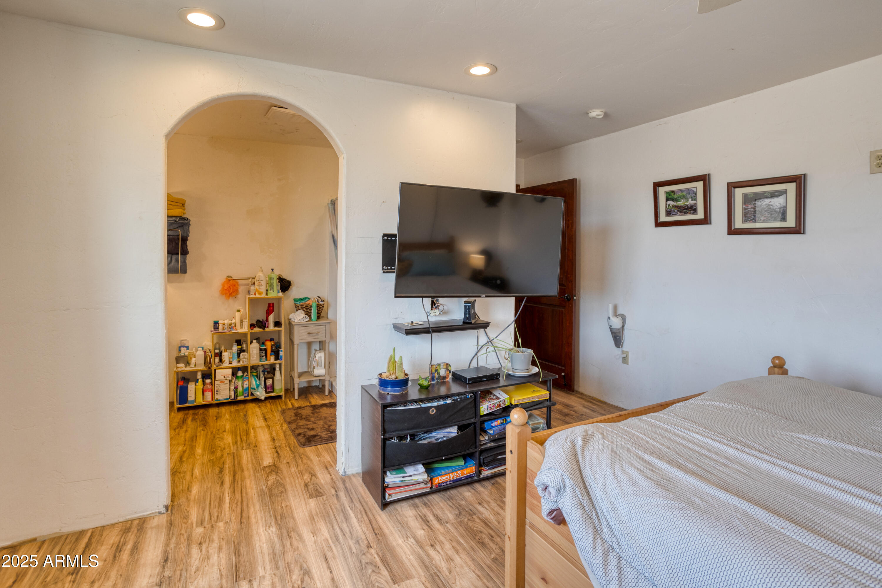 70 N5207 Concho, AZ 85924 - Photo 13 of 28 a bedroom with a bed and a flat screen tv
