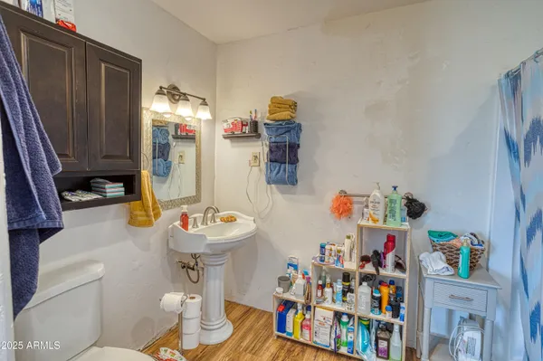 a bathroom with a sink mirror and vanity