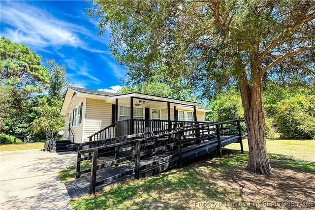 a view of a bench in the backyard