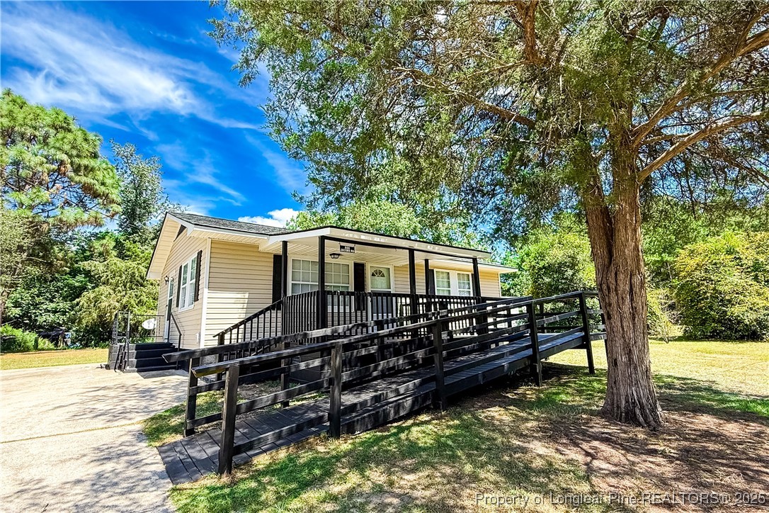 a view of a bench in the backyard