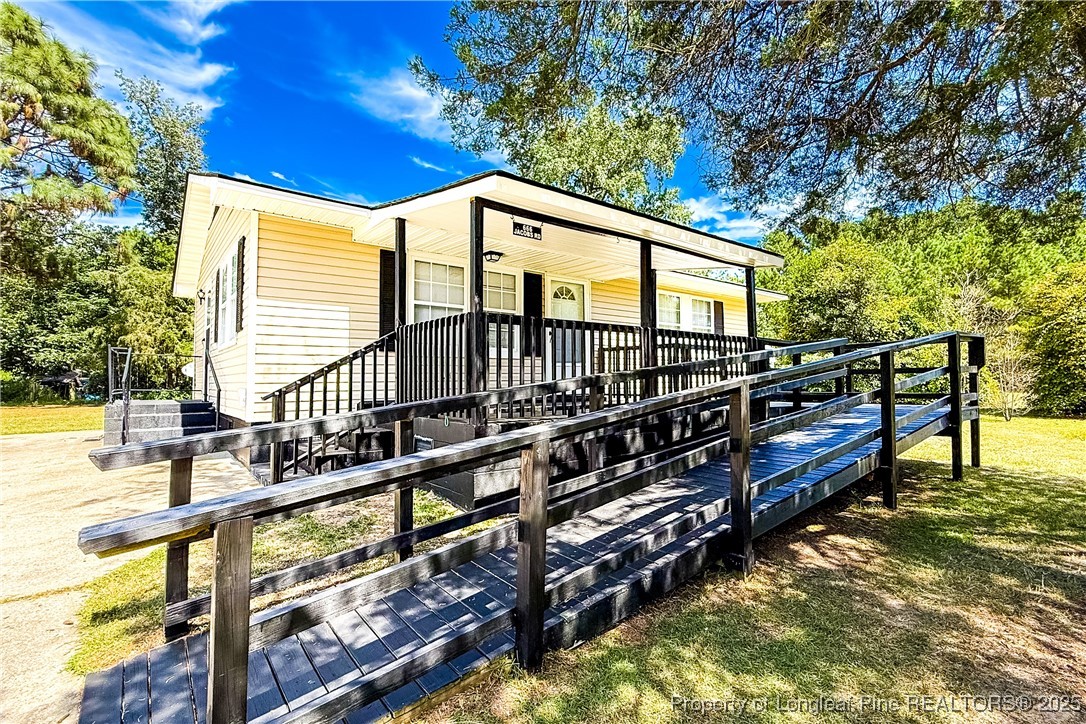 666 Jacobs Road Maxton, NC 28364 - Photo 2 of 30 a view of an house with swimming pool