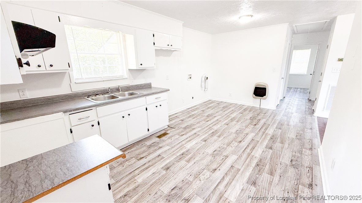 666 Jacobs Road Maxton, NC 28364 - Photo 21 of 30 a kitchen with granite countertop a sink a window and stainless steel appliances