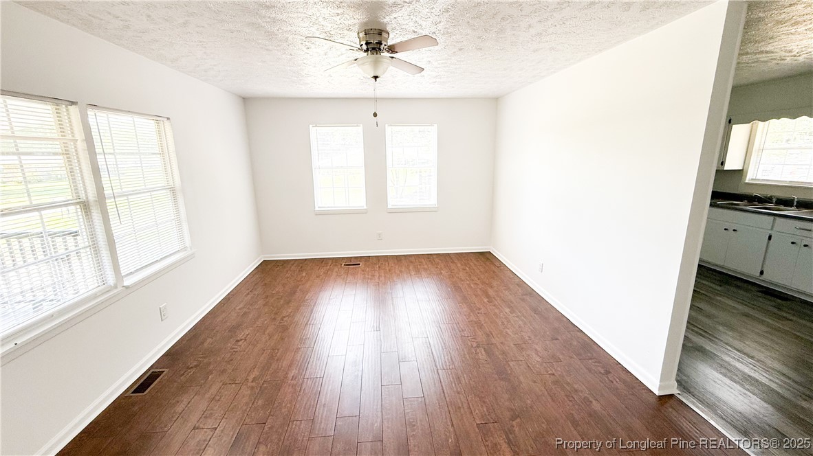 666 Jacobs Road Maxton, NC 28364 - Photo 28 of 30 a view of a room with wooden floor and a window